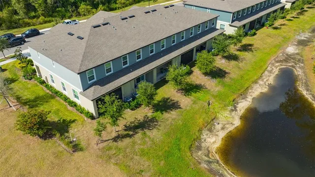 an aerial view of a house with a swimming pool