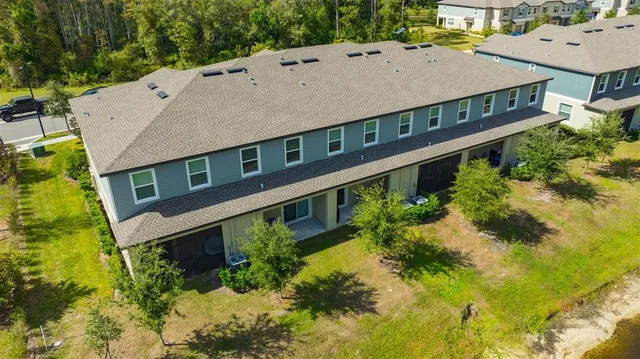 an aerial view of a house with a swimming pool