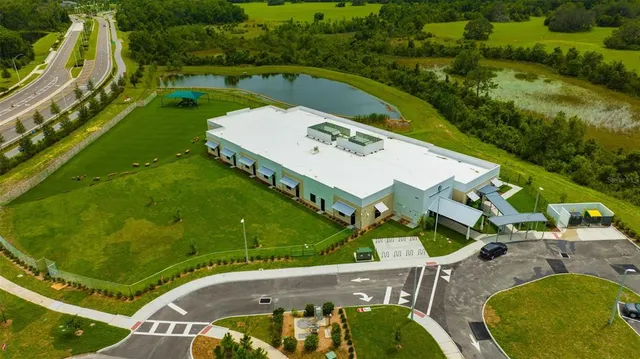a view of a tennis ground with a large pool