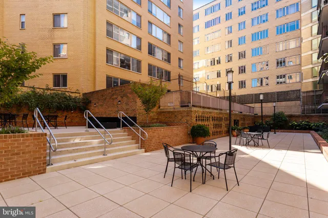 a view of a building with outdoor seating