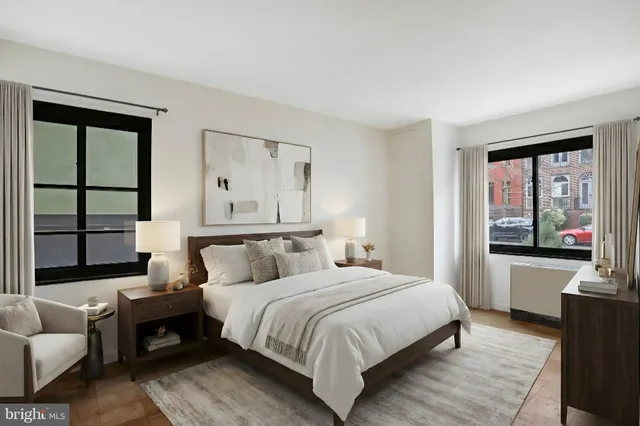 a bedroom with a bed and a couch