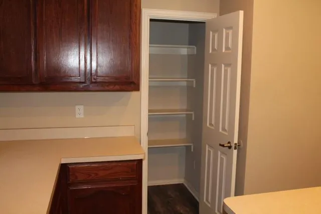 a kitchen with a sink and a refrigerator