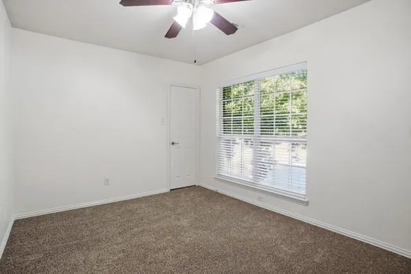 a bathroom with a double vanity sink mirror and shower