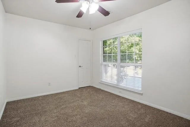 a bathroom with a double vanity sink mirror and shower
