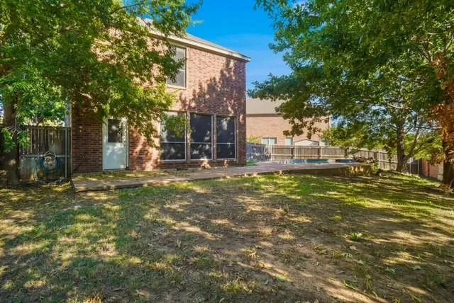 a view of an empty room with chandelier