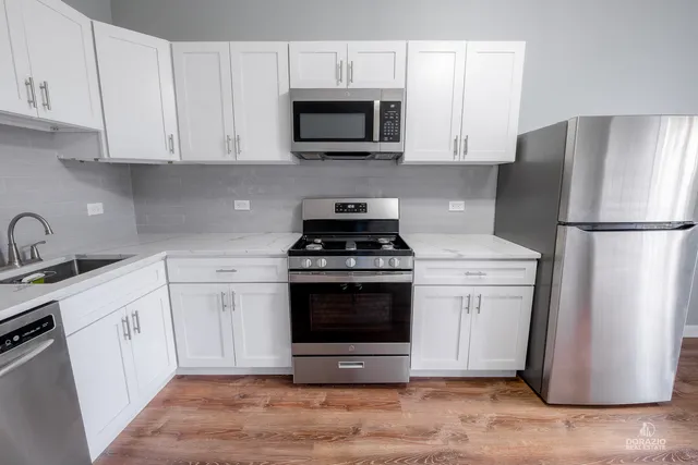 a kitchen with a stove and a microwave