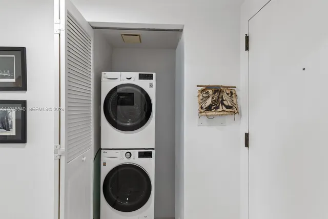 a view of a hallway with washer and dryer
