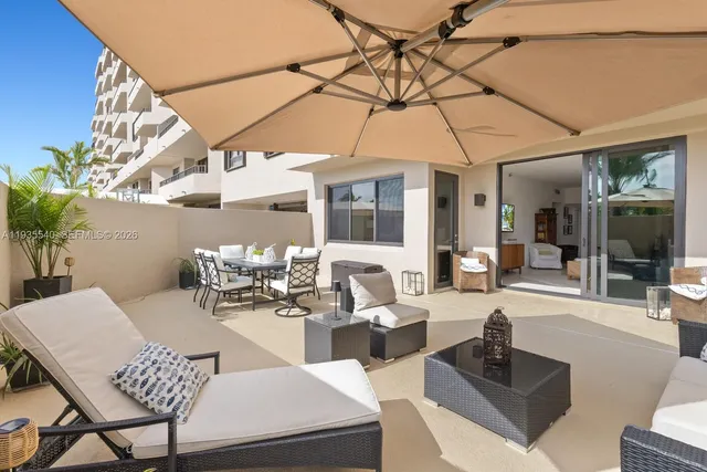 a view of a dining room with furniture wooden floor and chandelier
