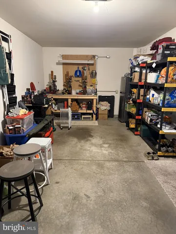 a living room with lots of furniture and a flat screen tv