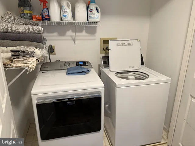a stove top oven sitting inside of a kitchen