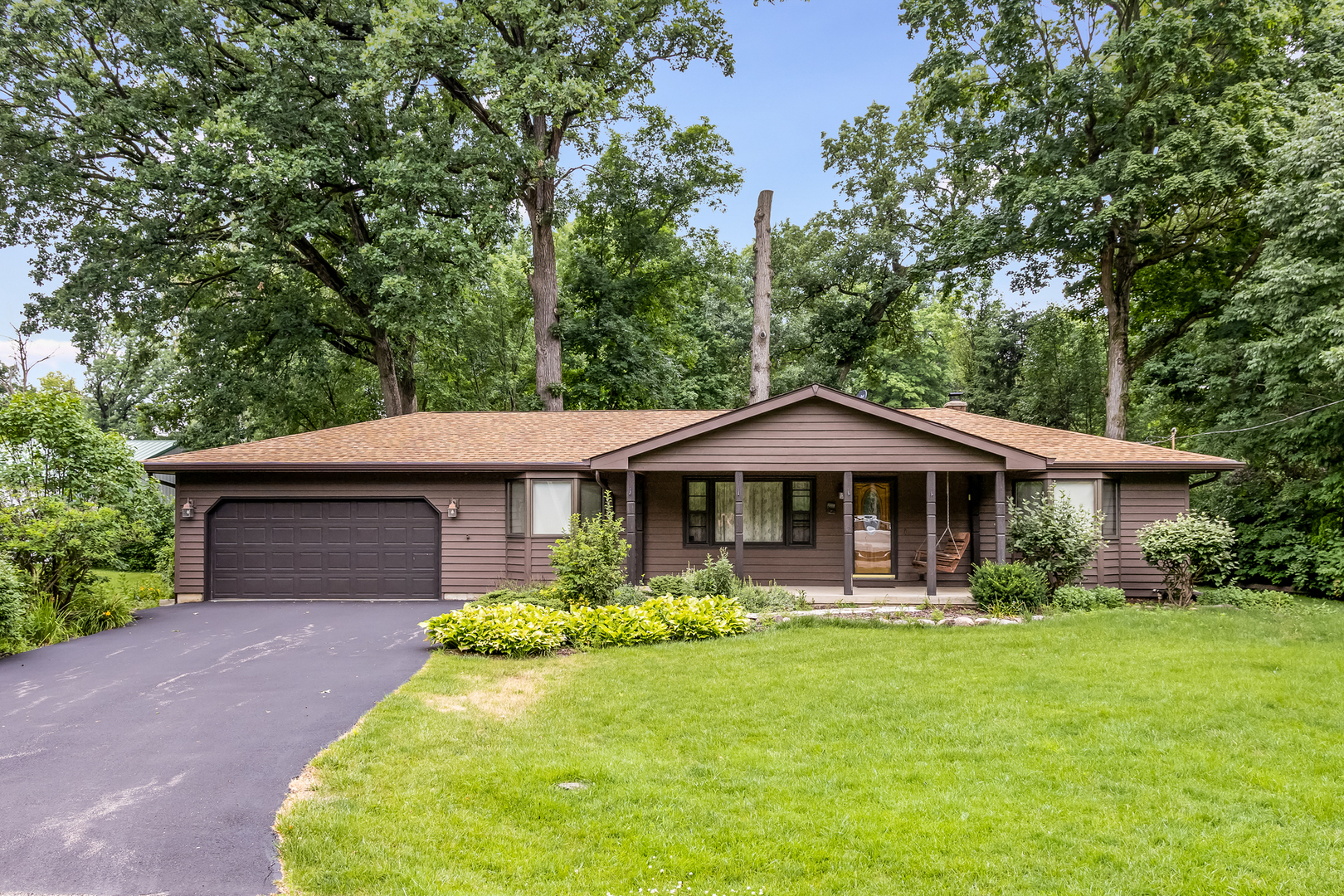 42W420 Kedeka Road Sugar Grove, IL 60554 - Photo 1 of 32 a front view of a house with garden