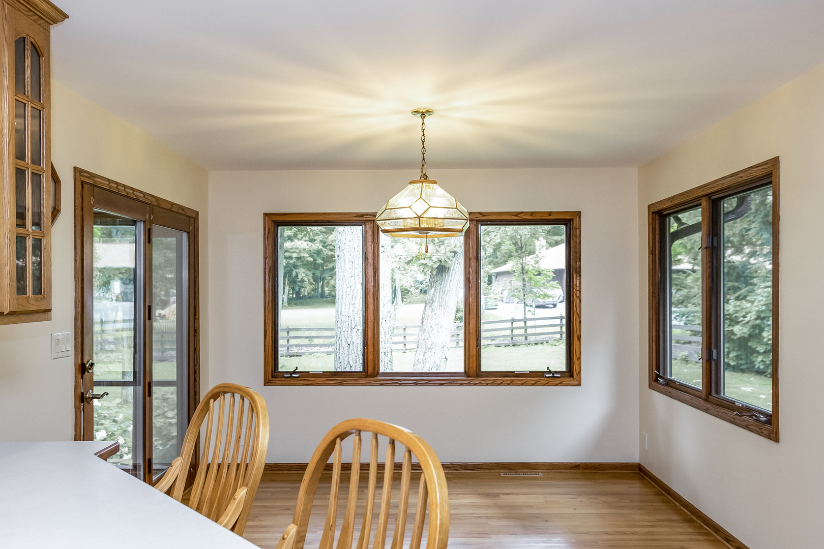 42W420 Kedeka Road Sugar Grove, IL 60554 - Photo 11 of 32 a view of empty room with wooden floor and fan