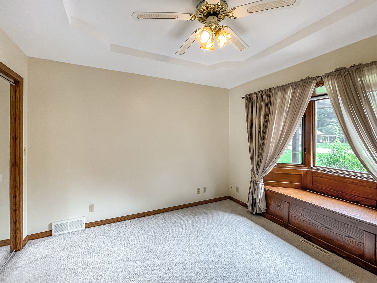 42W420 Kedeka Road Sugar Grove, IL 60554 - Photo 20 of 32 an empty room with windows and chandelier fan