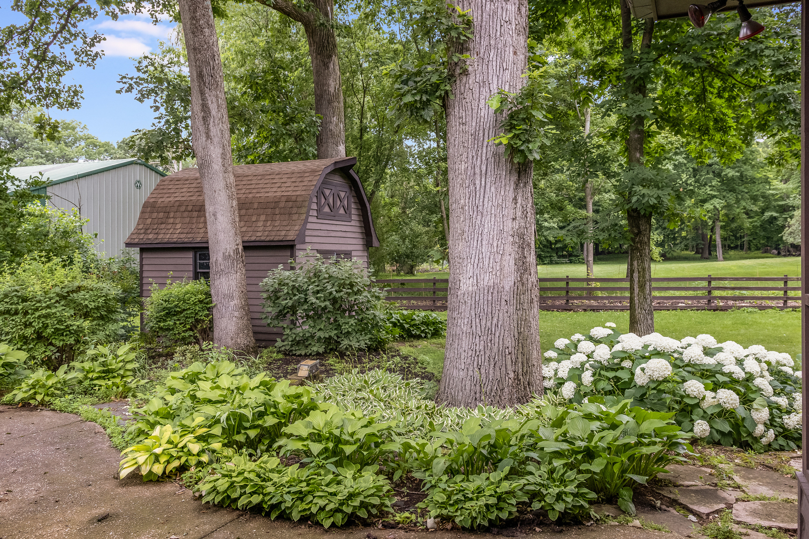 42W420 Kedeka Road Sugar Grove, IL 60554 - Photo 2 of 32 a front view of a house with garden