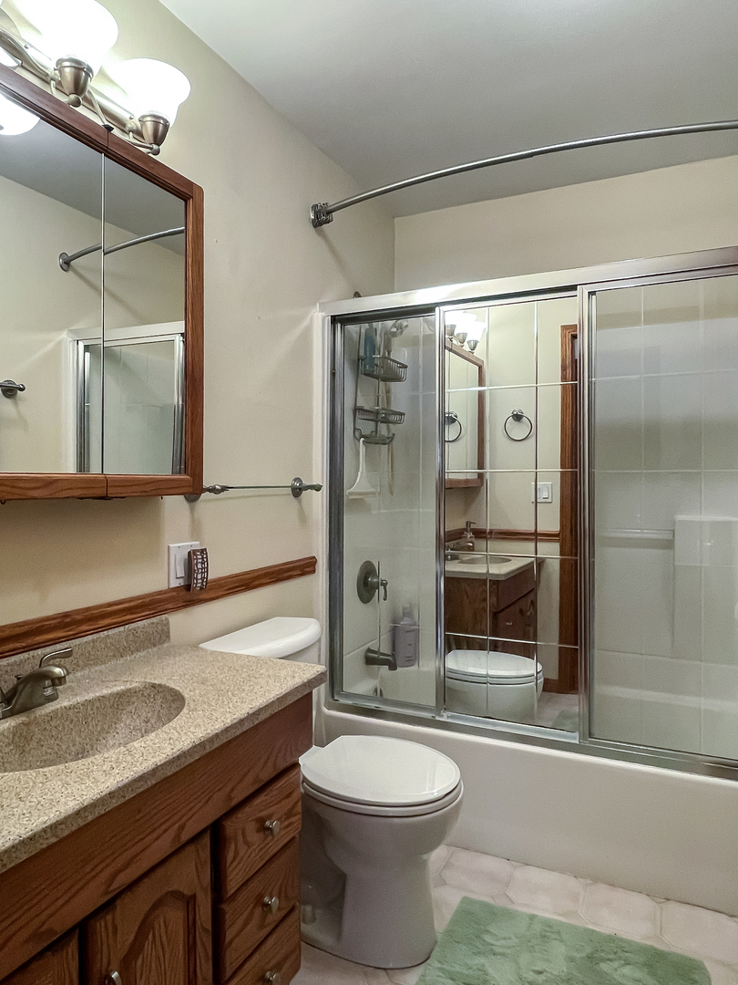42W420 Kedeka Road Sugar Grove, IL 60554 - Photo 22 of 32 a bathroom with a sink a toilet and shower