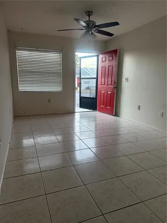 a view of an empty room with a window
