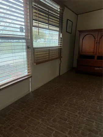 a view of a hardwood & staircase in an empty room