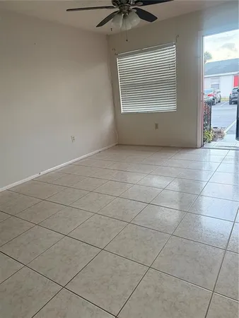 a view of a livingroom and window