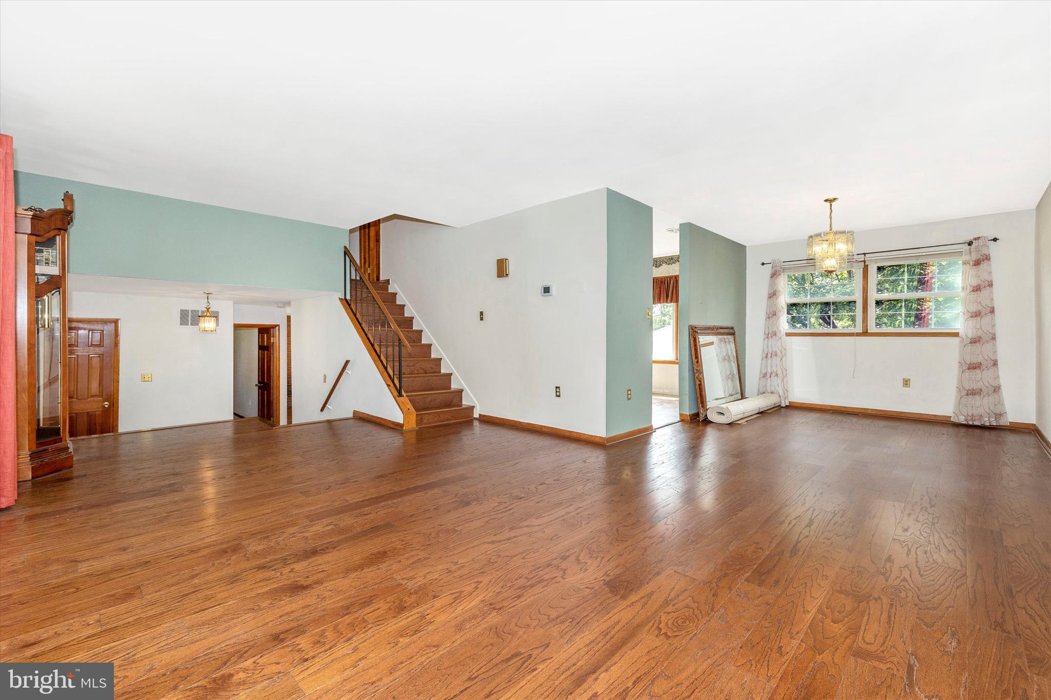 6795 Ruhland Drive Frederick, MD 21702 - Photo 23 of 36 Living room with adjacent dining room.