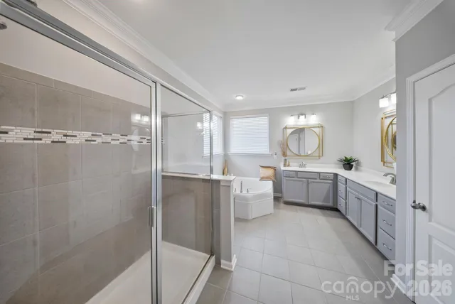 a bedroom with a bed and cabinets