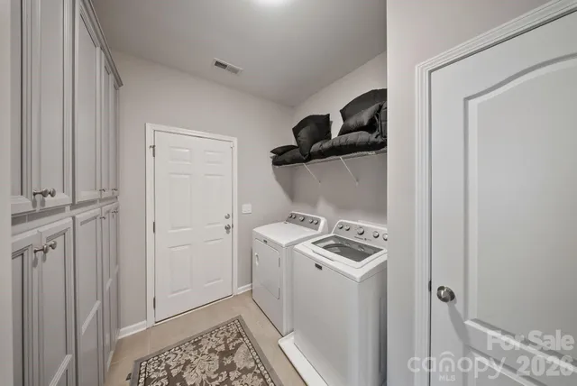 an aerial view of residential houses with outdoor space and street view