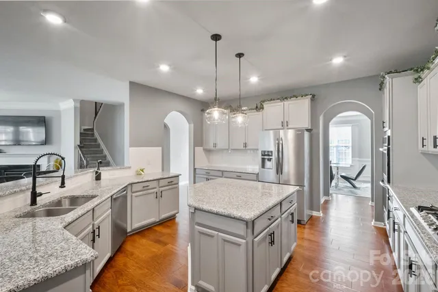 a view of a a dining room with furniture window and wooden floor