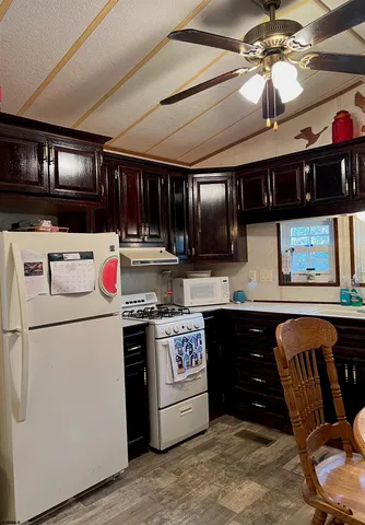 a kitchen with stainless steel appliances granite countertop a stove and a refrigerator
