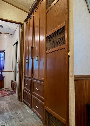 a view of a hallway with couch and chandelier