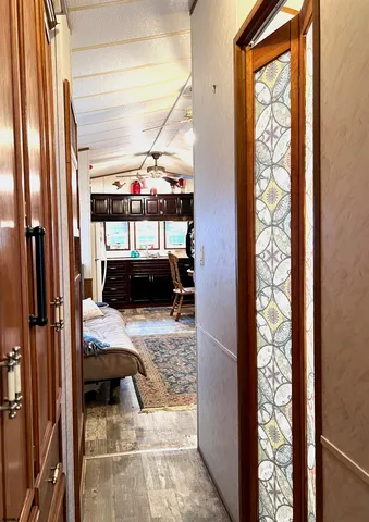 a view of a bedroom with bed and furniture