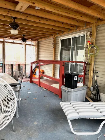 a view of a lake with a yard and covered with green space