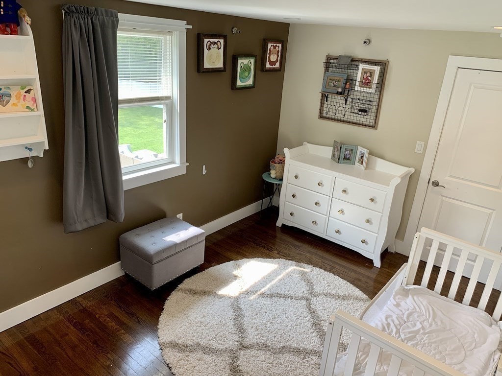 26 Chamberlain Road Chelmsford, MA 01824 - Photo 16 of 35 a bedroom with furniture and a window