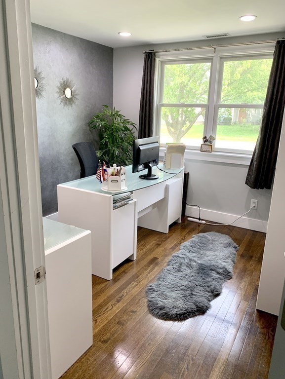 26 Chamberlain Road Chelmsford, MA 01824 - Photo 19 of 35 a living room with furniture and wooden floor