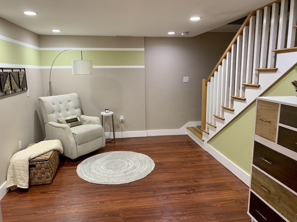 26 Chamberlain Road Chelmsford, MA 01824 - Photo 22 of 35 a bedroom with furniture and a wooden floor