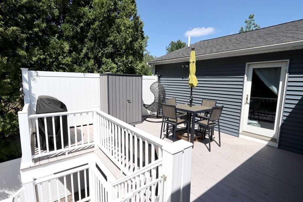 26 Chamberlain Road Chelmsford, MA 01824 - Photo 32 of 35 a view of a patio with a table and chairs