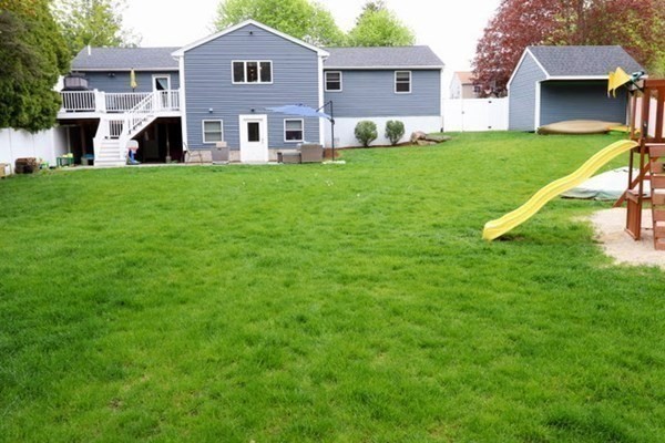 26 Chamberlain Road Chelmsford, MA 01824 - Photo 34 of 35 a front view of house with yard and green space