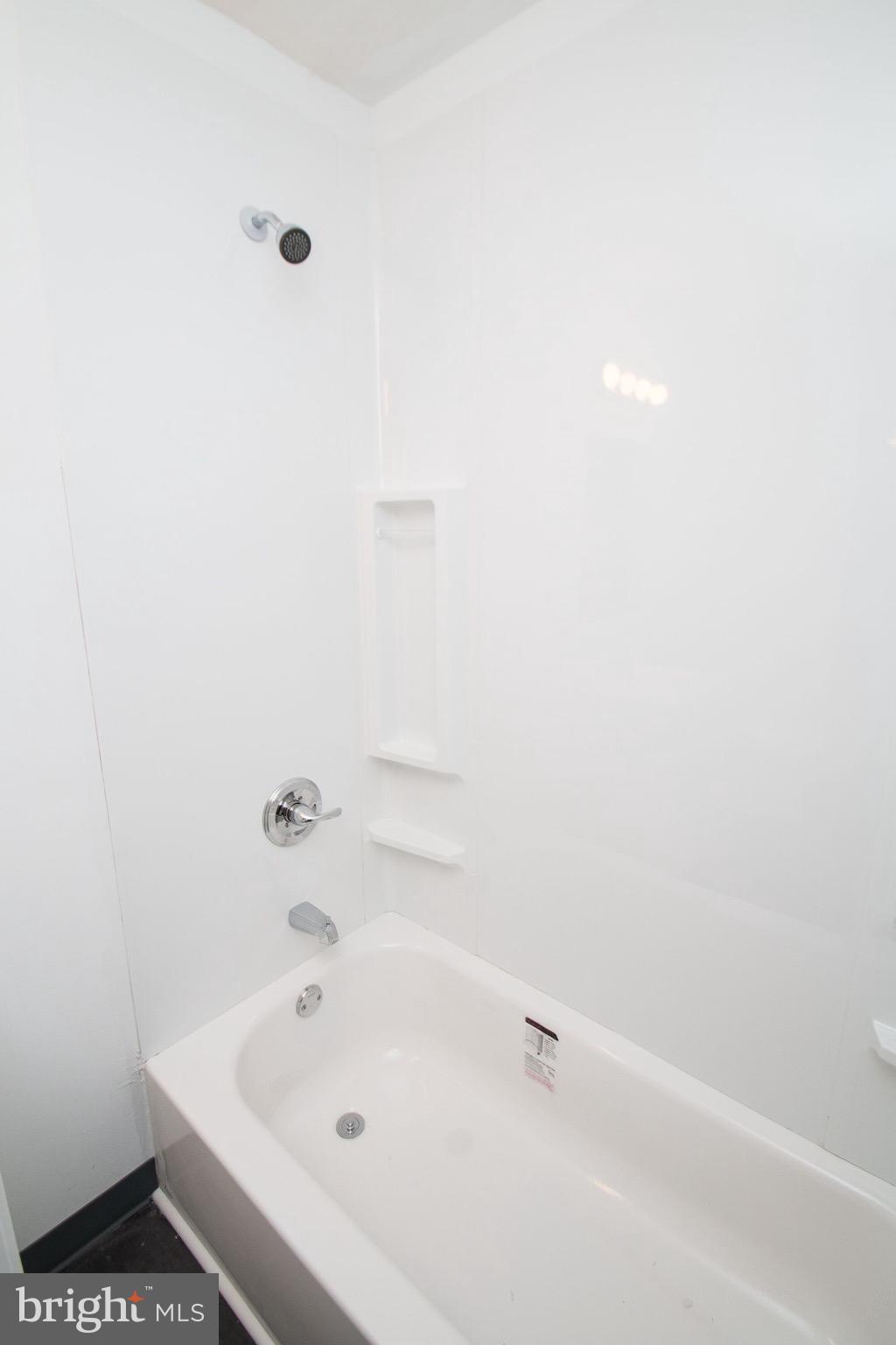 5850 North 13th Street, Unit 306 Philadelphia, PA 19141 - Photo 3 of 4 a bathroom with a bathtub