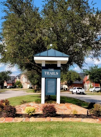 a front view of a house with a yard table and chairs