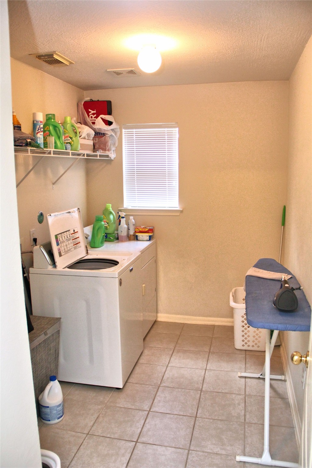 10234 Turrett Point Lane Houston, TX 77064 - Photo 4 of 17 a white bath tub sitting next to a white toilet and vanity