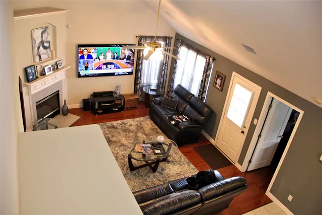 a living room with furniture and a flat screen tv