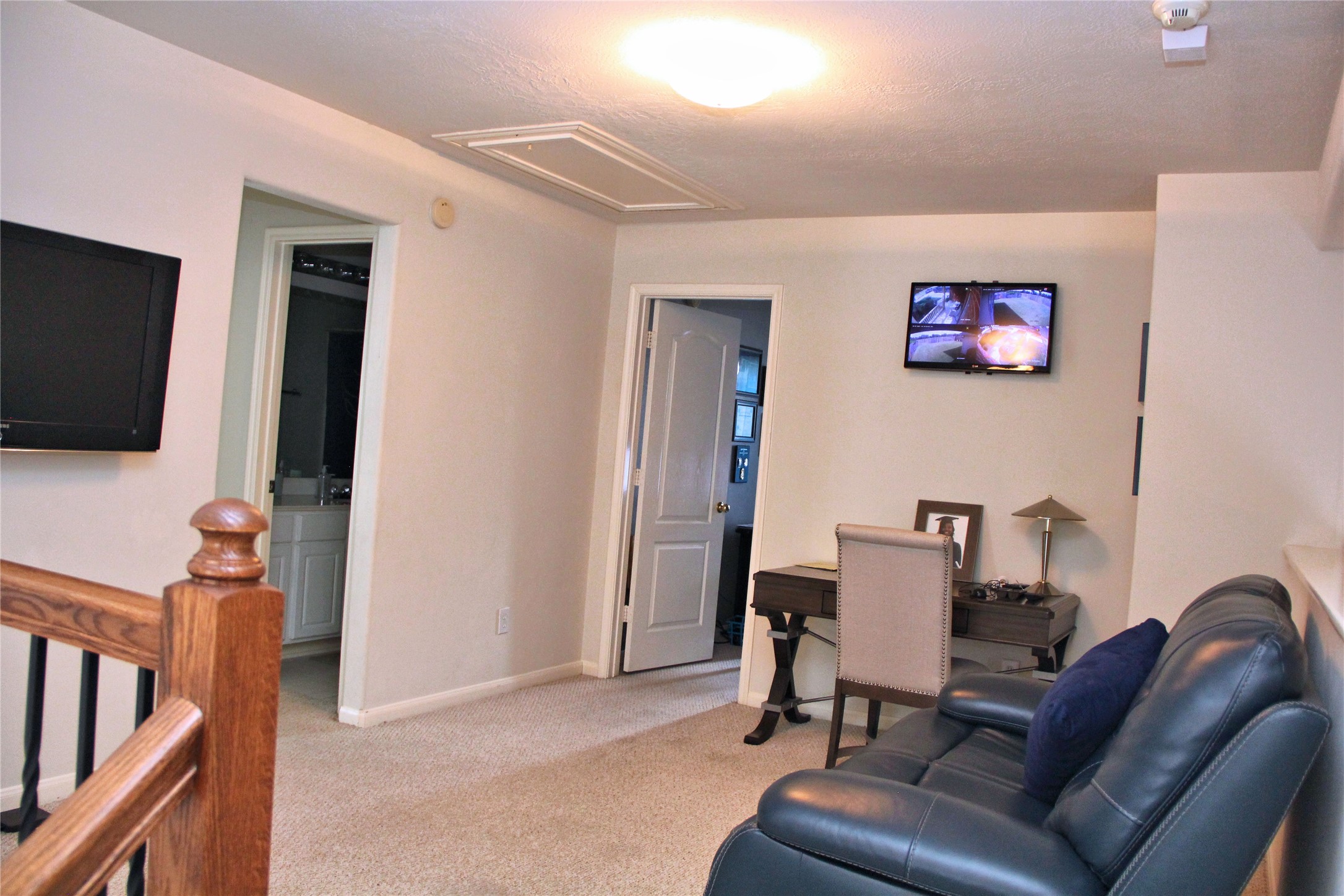 10234 Turrett Point Lane Houston, TX 77064 - Photo 8 of 17 a view of a livingroom with furniture and a flat screen tv