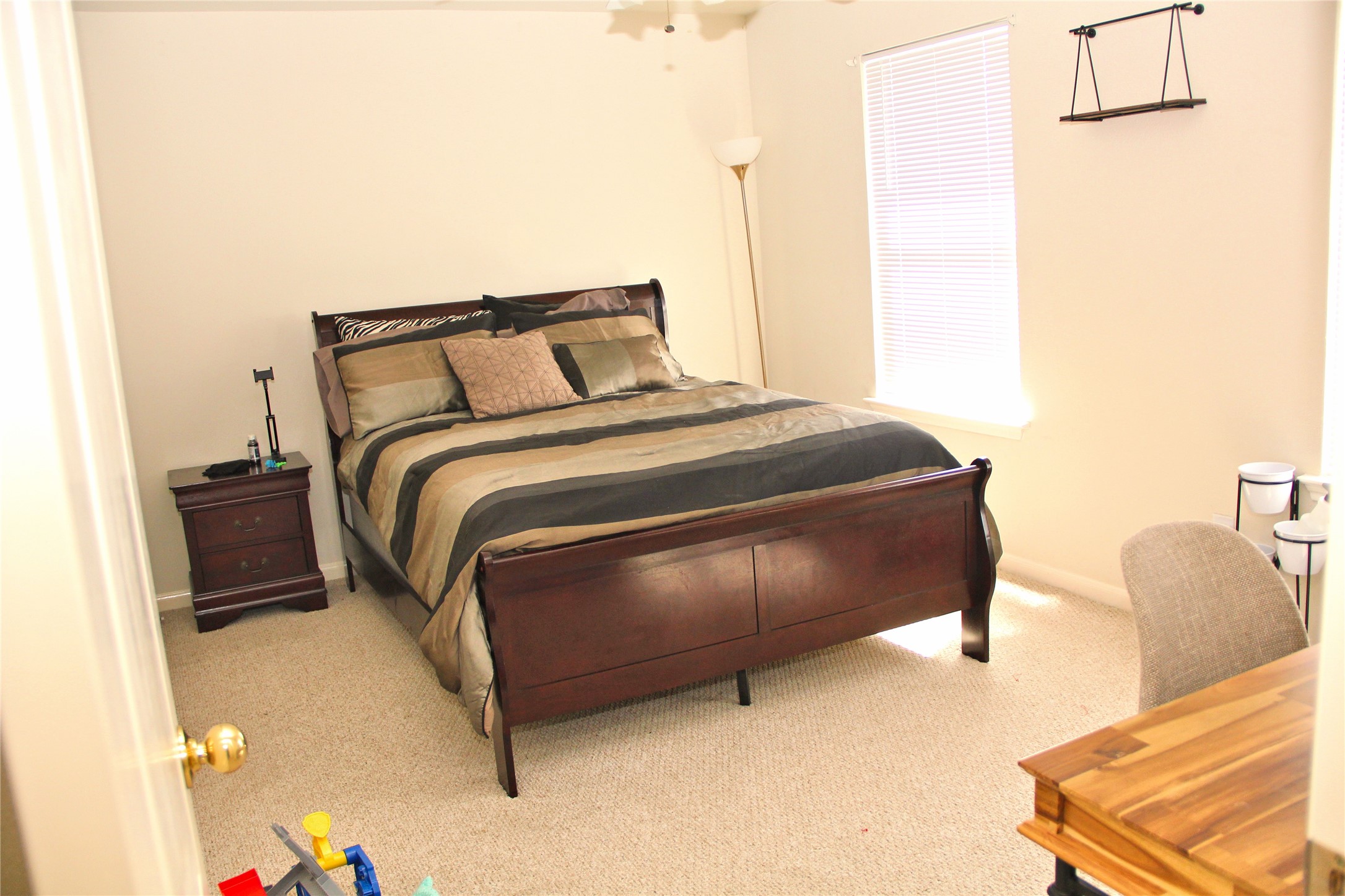 10234 Turrett Point Lane Houston, TX 77064 - Photo 9 of 17 a bedroom with a bed and a couch