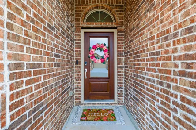 a view of a door and a window