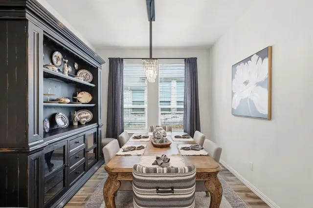 a dining room with furniture and window