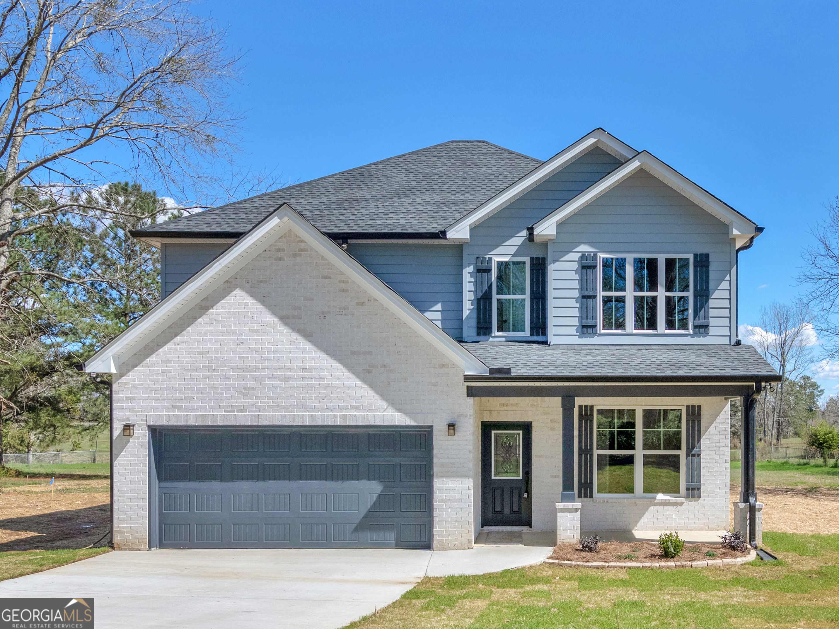 204 Church Road Hampton, GA 30228 - Photo 1 of 1 a house view with a garden space