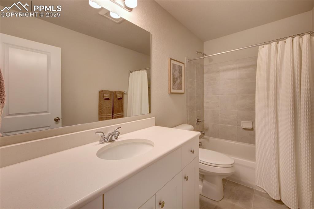 6069 Inman View Colorado Springs, CO 80924 - Photo 25 of 38 a bathroom with a sink toilet and shower