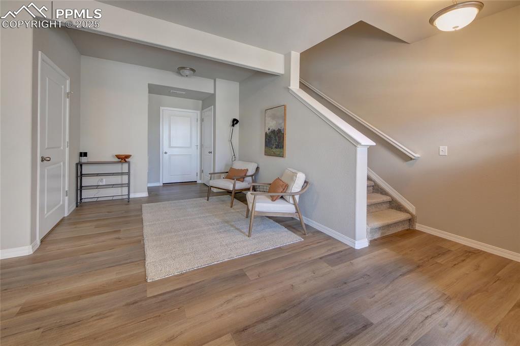 6069 Inman View Colorado Springs, CO 80924 - Photo 3 of 38 a living room with furniture and a wooden floor