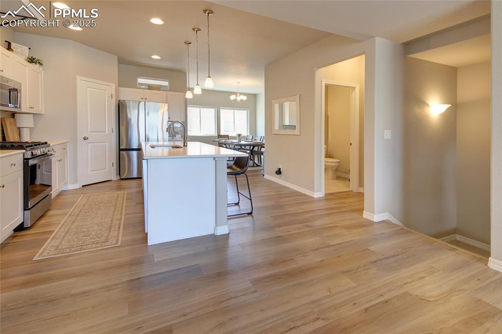 6069 Inman View Colorado Springs, CO 80924 - Photo 3 of 38 Kitchen with Dining beyond.