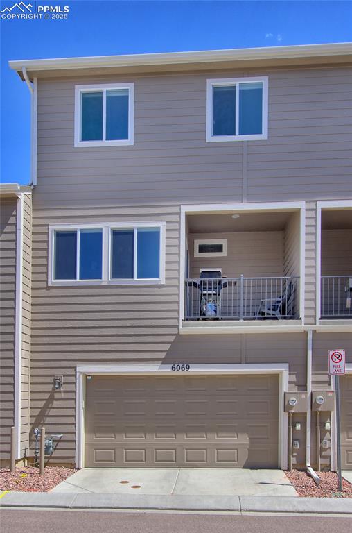 6069 Inman View Colorado Springs, CO 80924 - Photo 34 of 38 a view of building with car parked