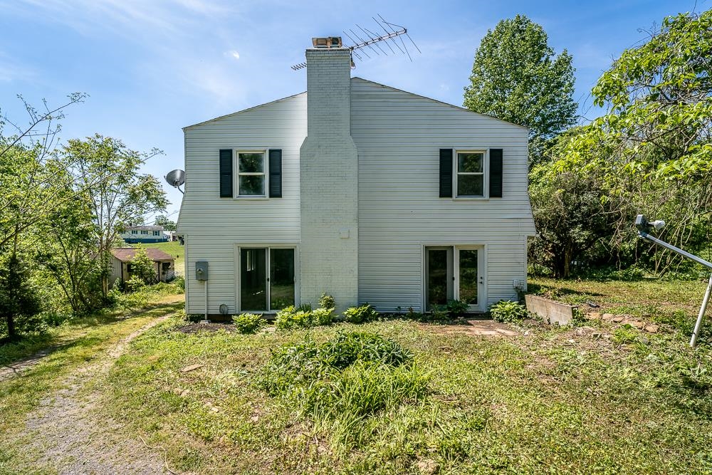 660 Tryme Road Reva, VA 22735 - Photo 31 of 40 a view of a house with a yard and potted plants