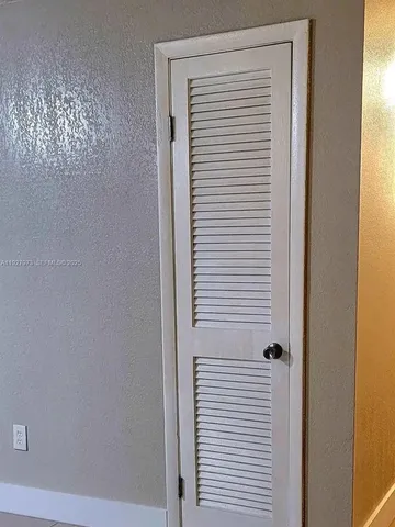 a view of a bathroom with a white door